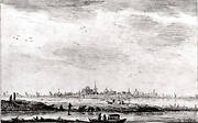 Distant Town Seen across Water and Fields